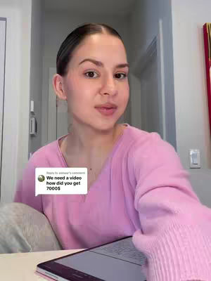 The cover image shows a young woman in a pink sweater, seated and looking towards the camera with a neutral expression. A speech bubble shows a comment on the video from a user and the tablet is on the table. The background suggests a home or office setting.