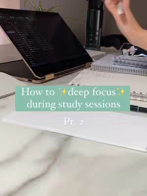 A workspace is shown, with a laptop open to the side, a water bottle, and some notebooks. Text overlayed for the hook.