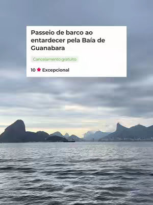 The image shows a scenic view of a bay with mountains in the background. The sky is overcast. A white rectangular box at the top of the image contains text and ratings.