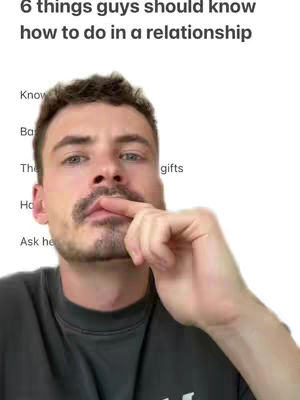 The cover image presents a selfie-style shot, focusing on a man from the chest up, set against a white background. The man has short, dark hair and a mustache. He is wearing a dark-colored shirt. His right index finger is touching his lips, and the expression appears thoughtful. The text overlay at the top states, "6 things guys should know how to do in a relationship". Below the title, there is a list of a few items, likely related to the video's content.