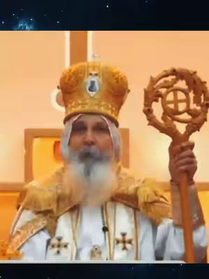 The cover image features a man dressed in religious attire holding a staff, composed within a slightly blurred golden-hued setting.