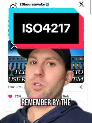 A man with a beard and a black cap is in front of a background showing an image of a Federal Reserve building and its surroundings. The overlaying hook text is in rectangular boxes, the top one being black and contains the white text "ISO4217", while at the bottom is a pink box with the text "REMEMBER BY THE".