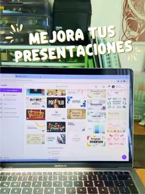 A laptop displaying presentation slides is open on a desk. The screen shows a selection of presentation templates. Above the laptop, there is a shelf with boxes and other items. The background is slightly out of focus.