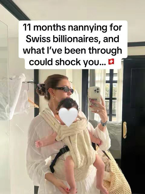 A person wearing sunglasses holds a baby in a baby carrier, with the baby's face blurred with a heart shape. The person appears to be in a well-lit room with what looks like a mirror and window in the background. A text overlay says, "11 months nannying for Swiss billionaires, and what I've been through could shock you..."