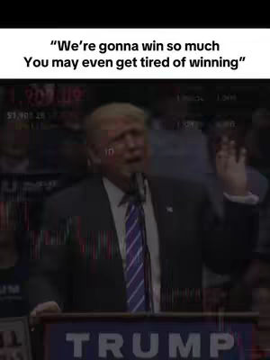 The cover image features a still of Donald Trump speaking at a podium. Text overlays on the top and bottom. The overall composition has a slightly blurred, news-like quality background.