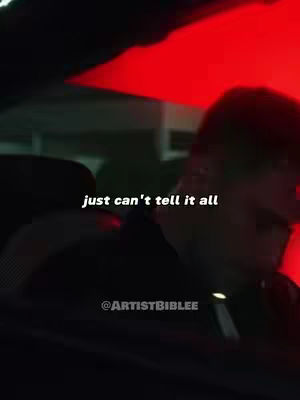 A dimly lit scene inside a vehicle, featuring a person in the driver's or passenger's seat, with text overlayed. A vibrant red light is visible. Text overlays that says 'just can't tell it all'.