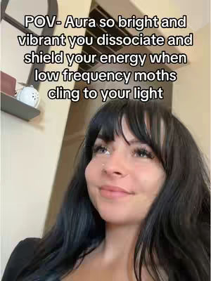 A young woman with long black hair and bangs is smiling and looking up. Text overlays the image.