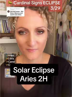 A selfie-style video with a woman facing the camera, framed from the chest up. The background is a blurred collection of items on shelves. Text overlays include the title "Cardinal Signs ECLIPSE 3/29" at the top and "Solar Eclipse Aries 2H" at the bottom. Additional text and icons, including the zodiac signs Aries, Libra, and Cancer, are positioned on the left side.