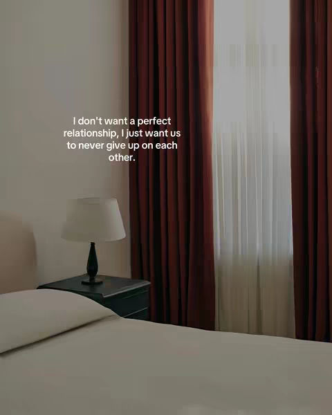 The image is a bedroom scene. The primary colors are white and brown. In the foreground is a bed covered with a white sheet. To the right, there is a window with reddish-brown curtains. Behind the bed, there a white wall. On the left, there is a lamp on a nightstand. The hook text is superimposed on the scene, centered and set in white.