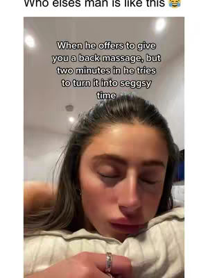 A selfie-style shot showing a woman's face close-up, resting on a pillow, with closed eyes. Text overlays partially cover the image, with the woman's hand and a ring visible.