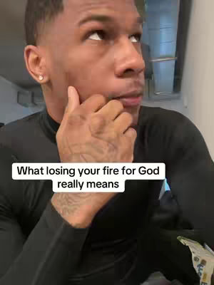 A close-up shot of a man with short hair looking up and to the side. He has a thoughtful expression, with his right hand touching his cheek. Below him is a text overlay.