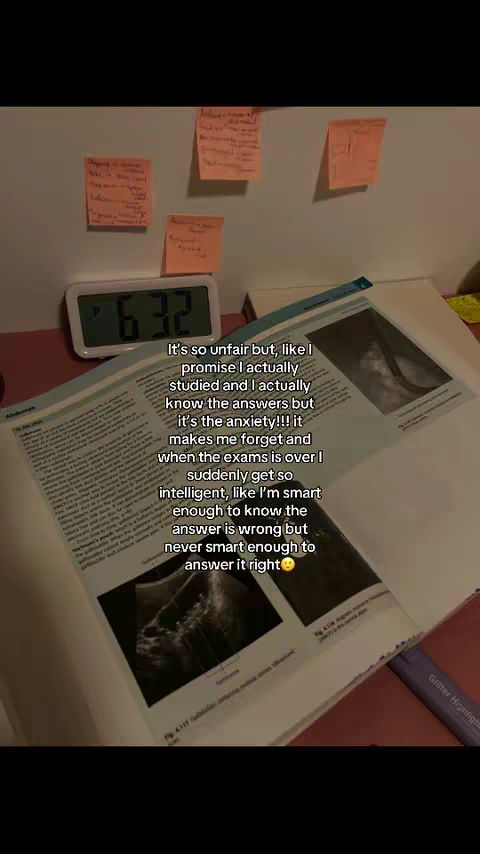 The image shows a study setup. There is an open textbook, sticky notes, and a digital clock showing 6:32. The text overlay focuses on the relatable experience of exam anxiety.