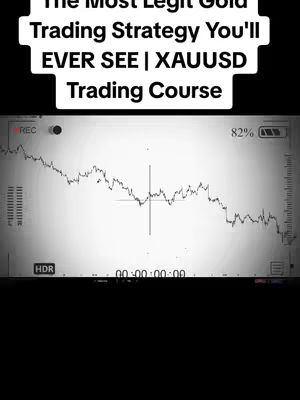 The cover image is a vertical shot, likely for a mobile platform, with a black background. At the top is a white text overlay with the title "The Most Legit Gold Trading Strategy You'll EVER SEE | XAUUSD Trading Course". Below that, there is a screenshot of a trading layout. The primary color scheme is grayscale, with a trading chart taking up much of the screen. The chart displays lines with fluctuations, possibly showing price movements, against a light background. Other indicators such as 'REC', a camera icon, and a battery indicator are present. The overall design is clean and professional with the intention of presenting information related to trading.