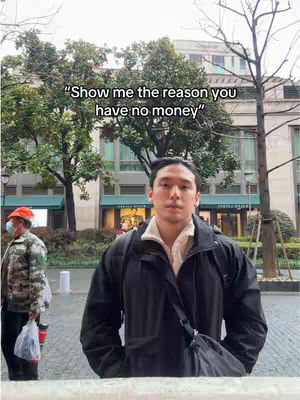 A man stands in front of an urban background, the image includes text overlayed on top saying, "Show me the reason you have no money."