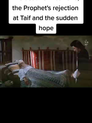 A scene from a historical or religious narrative. An elderly person lies in a bed with a patterned blanket, while another person approaches the bed. Text overlay at the top describes the scene.