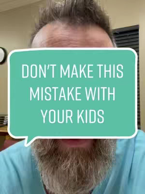 A close-up shot of a man with a beard and spiky hair. He is wearing a light blue shirt and a speech bubble that says 'DON'T MAKE THIS MISTAKE WITH YOUR KIDS.'
