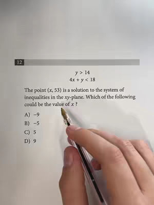 A person's hand holding a pen is pointing to a math problem related to inequalities printed on a white paper. The paper has a lined border at the top and is numbered with the number 12 on the left. The text of the question reads, 'The point (x, 53) is a solution to the system of inequalities in the xy-plane. Which of the following could be the value of x? A) -9 B) -5 C) 5 D) 9'. The background is plain and off-white.