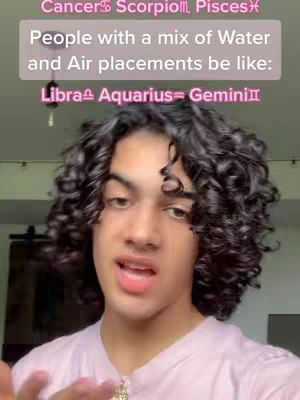 A young man with curly dark hair is shown in a selfie-style shot, appearing to be talking directly to the camera. Above his head, text overlays display astrological sign symbols and phrases. The background is simple, suggesting an indoor setting.