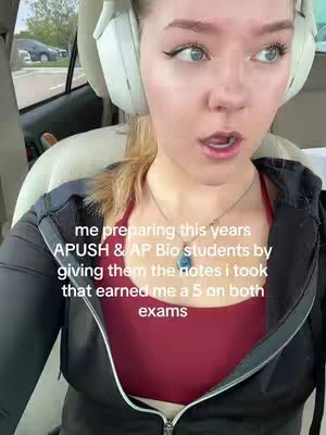 A young woman wearing headphones sits in a car, looking towards the camera with a slight expression of surprise. White text overlayed on the image provides information about the video's content.