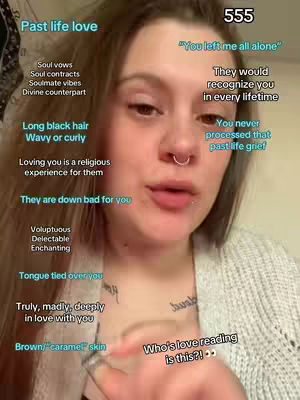 A close-up shot of a woman with brown hair, a septum piercing, and light skin. She is looking directly at the camera with a neutral expression. Text overlaid on the image includes phrases like "Past life love," "Long black hair," and "Brown/caramel skin," along with other related keywords. The background is minimalist, focusing attention on the woman and the text elements.