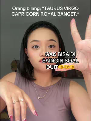 A woman with dark hair and fair skin is the main subject. She is looking at the camera with a slight frown and covering a part of the frame with her fingers. Text overlays the image, and the background has a blurred appearance, likely denoting an indoor setting.