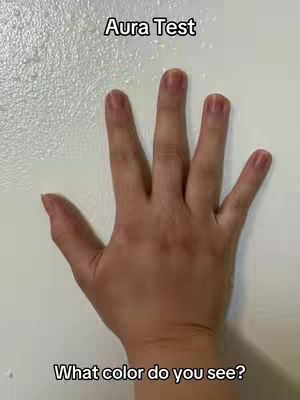 The image displays a close-up of a hand against a smooth, off-white surface. The hand, with visible skin texture and slightly visible nails, is positioned with the palm facing the viewer and the fingers spread. Two lines of white sans-serif text are placed above and below the hand, forming the video's hook.