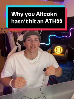 The cover image features a young man in a white t-shirt, seated in front of a desk with a microphone clipped to his shirt. A text overlay at the top reads, 'Why you Altcokn hasn't hit an ATHOO'. Behind him, a neon sign illuminates the background, and a Bitcoin symbol is on display. The overall composition is well-lit, suggesting a modern and tech-focused setting.