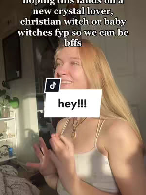 The cover image shows a young woman with long blonde hair and a white tank top, captured from the bust upwards. She is smiling, with her hands up in a gesture of excitement or greeting. The background is slightly blurred, hinting at an indoor setting with neutral colors. Text overlays include a greeting and content description.