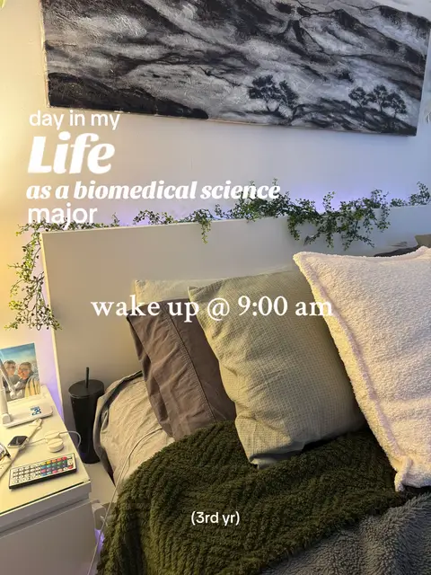 The image shows a bedroom scene. The main focus is a bed with multiple pillows and a green blanket. Above the bed is a painting and strings of greenery. Text overlays describe the scene.