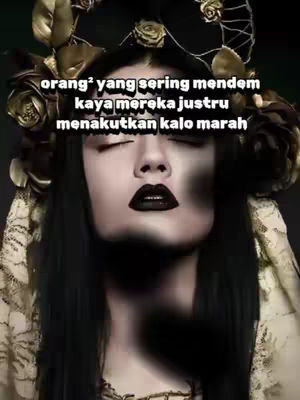 A close-up shot features a woman with striking makeup and a dark, embellished headpiece. Her eyes are closed, and her lips are painted black, giving an intense expression. Text overlays are present, indicating a thematic focus. The background is a gradient of dark colors, possibly a studio setting, which enhances the focus on the central figure.