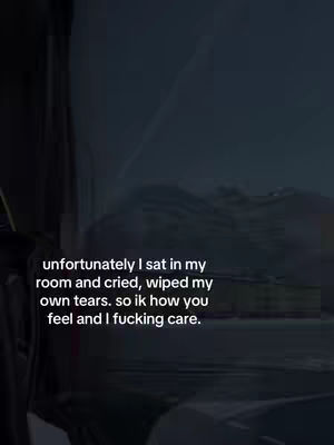 The cover image features a dark, slightly blurred outdoor scene, likely viewed through a window. Superimposed on the scene is white text expressing a message of empathy, set in a sans-serif font. The composition uses a somber palette of dark blues and blacks with the text acting as the focal point.