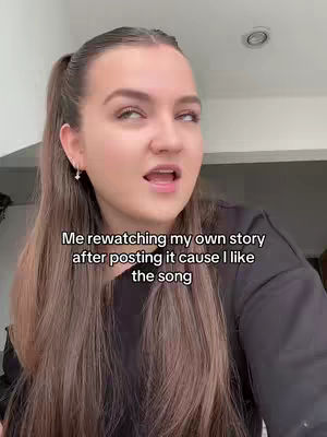 A woman with long brown hair and a black top is looking up and slightly to the side with a surprised expression. Text overlay on the image.