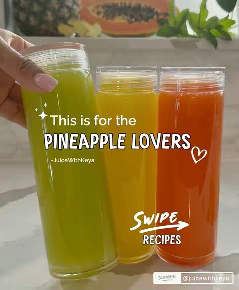 The cover image showcases three tall glasses of juice, varying in hues of green, yellow, and orange, arranged in a row. The glasses are set against a bright background. The image has overlaid text in various positions. In the background, glimpses of fruit, possibly papaya and pineapple, suggest the ingredients of the juice. Overall, the image is clean, bright, and inviting.