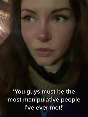 A close-up shot of a young woman's face with a serious expression. Her eyes are focused to the side, and her skin has a slightly pink tone. Text overlayed at the bottom reads a quote.