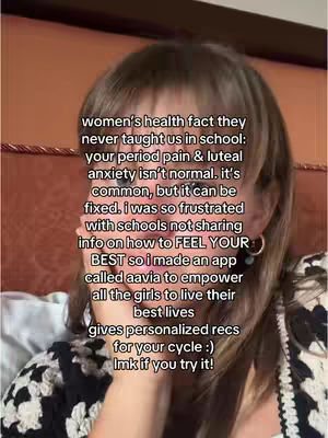 The cover image presents a close-up shot of a woman with light brown hair, angled slightly toward the left of the frame. The background is a soft, warm reddish-brown. The woman has a pale complexion and is wearing a dark top with a textured pattern. Her face takes up most of the frame, with text overlayed, describing the problems of women's health and the creation of an app.