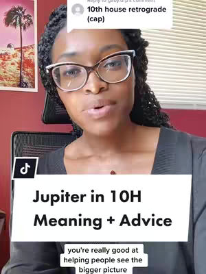 A woman with glasses and a black top looks directly at the camera. A white banner at the bottom of the frame reads: 'Jupiter in 10H Meaning + Advice' with a smaller banner saying 'you're really good at helping people see the bigger picture'. The background includes a white striped window, and a framed picture on the left featuring a painting of palms.