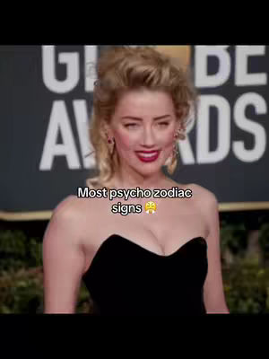 The cover image features a woman in a black, strapless dress posing in front of a background of an awards show. The text overlay reads "Most psycho zodiac signs".