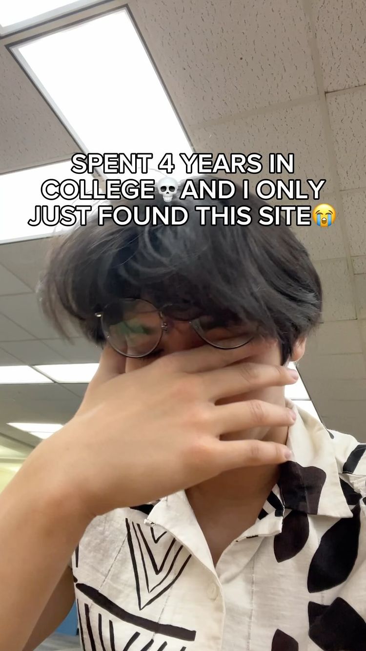 The cover image shows a young person with short, dark hair in a close-up shot. They are wearing glasses and a patterned shirt primarily white with black, abstract shapes. The person is covering their face with one hand, conveying a sense of dismay. Above them, a text overlay states, "SPENT 4 YEARS IN COLLEGE 💀 AND I ONLY JUST FOUND THIS SITE 😭". The background includes a ceiling with overhead lights. The overall composition is a blend of portrait shot and text, emphasizing the person's reaction.