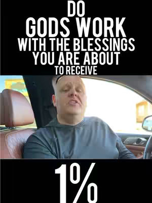 A man in a car interior, seen from a medium shot, is the primary focus. The man, who appears to be the content creator, has short hair and is wearing a gray shirt. Above him, a black bar carries the text 'DO GODS WORK WITH THE BLESSINGS YOU ARE ABOUT TO RECEIVE' in white. Below the man, a black bar displays '1%' in a large, bold font, also in white, with the percentage symbol clearly visible. The car interior includes the car seat, dashboard, and window. The lighting seems natural, and the composition is simple.
