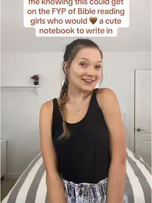 The cover image features a young woman with a braid, smiling and looking towards the camera. She is wearing a black tank top and a pair of high-waisted shorts, likely in her room. There is text overlay at the top with a heart symbol.