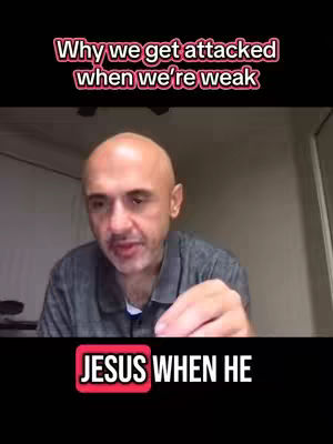 A man with a shaved head and a gray shirt speaks directly to the camera. Text overlays are present, highlighting the video's topic with visual elements. The lower section contains a black bar with white text that says, "JESUS WHEN HE".