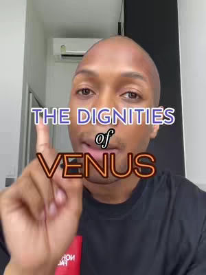 A man with a shaved head looks towards the camera, pointing with his right index finger. Text overlays include 'THE DIGNITIES of VENUS' in a bold font. The setting appears to be indoors.