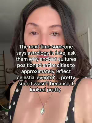A selfie-style video cover featuring a woman with dark hair, looking directly into the camera. Text overlayed in black font, conveying her message. The shirt has a dotted pattern, a necklace, and a room in the background.