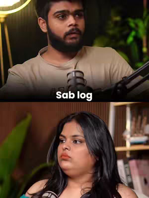 The cover image is a split screen featuring two people. The top half shows a man with a beard looking up, positioned with a microphone in front of him. The bottom half displays a woman looking left with a neutral expression.