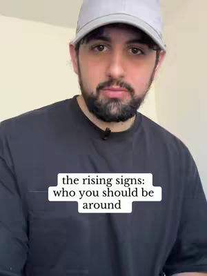 A man with a beard and a grey cap is the main subject, he is facing the camera. The hook is a text overlay. The background is a plain cream wall. The man is wearing a black t-shirt.
