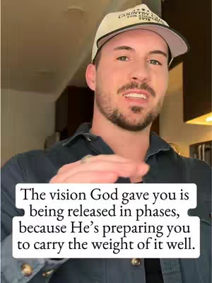 A man in a baseball cap and dark blue shirt is speaking. Overlayed on the image is a white rectangle with black text.