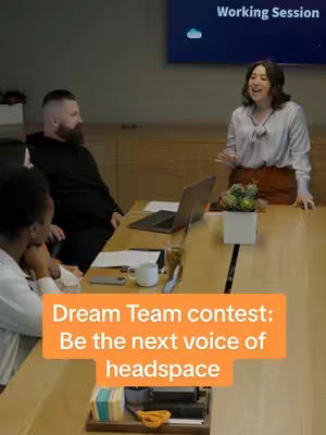A cover image shows a collaborative work environment, featuring a long wooden table with several people around it. A woman is standing at the end of the table, gesturing and speaking with a cheerful expression. On the table are a laptop, papers, and office supplies. The background suggests an office setting with a screen displaying the words 'Working Session'. An orange banner at the lower-center highlights the contest details.