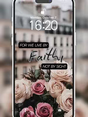 A phone screen displaying a floral wallpaper with roses and a building background. Overlay text includes a Bible verse.
