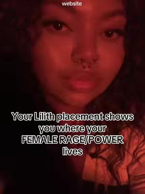 A close-up shot focuses on a person's face, framed with a red hue. The person has dark eyes, visible eyelashes, and multiple nose piercings. The text overlay in white font, positioned below the face, reads, "Your Lilith placement shows you where your FEMALE RAGE/POWER lives."