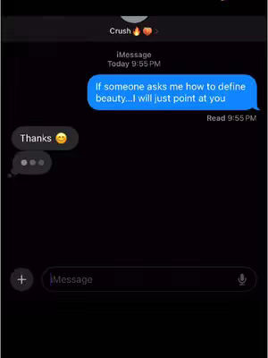 The image shows a smartphone screen displaying a text conversation. The background is black. The conversation is with a contact labeled "Crush," indicated by the name at the top with emojis. There are two speech bubbles: One from the contact that says "If someone asks me how to define beauty...I will just point at you" and one from the creator with the text "Thanks" and a smiling face emoji. There is a text input field at the bottom.